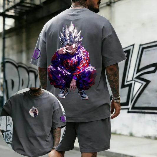 T-shirt grigio Dragon Ball Goku Ultra Instinct accovacciato e aura viola
