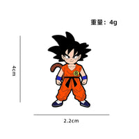Goku enfant debout en tenue orange