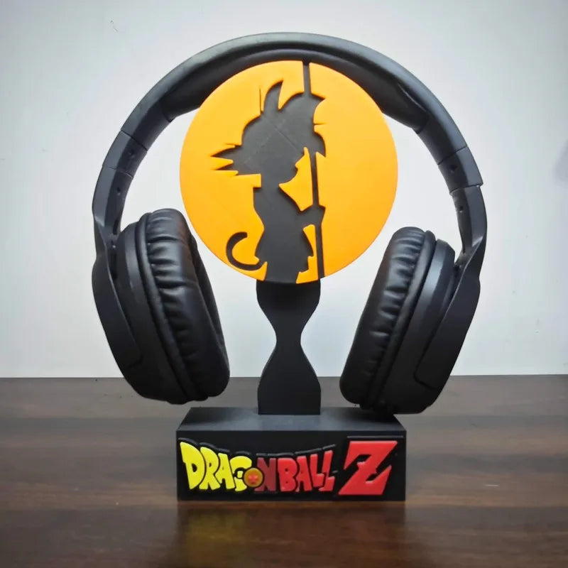 Soporte para auriculares negro Dragon Ball - silueta de Goku delante de un disco naranja